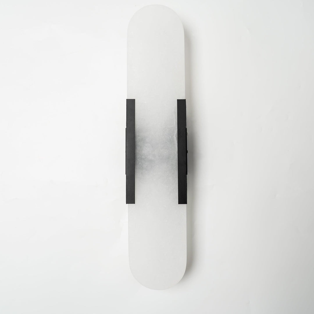 Aplique LED de pared, textura mármol, moderno, luz indirecta para un ambiente cálido.