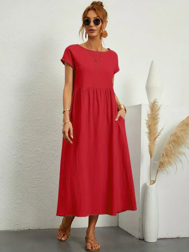 Elegancia y fluidez en este vestido midi de mujer, ideal para verano.