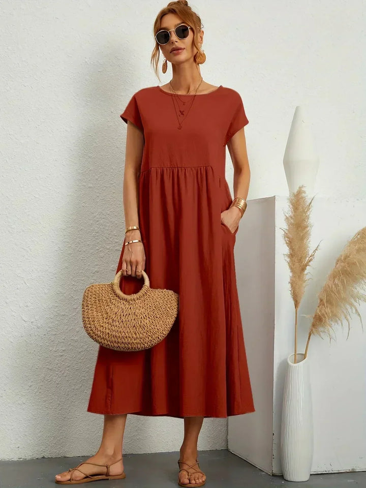 Vestido midi elegante, diseño fluido que aporta confort a la mujer.