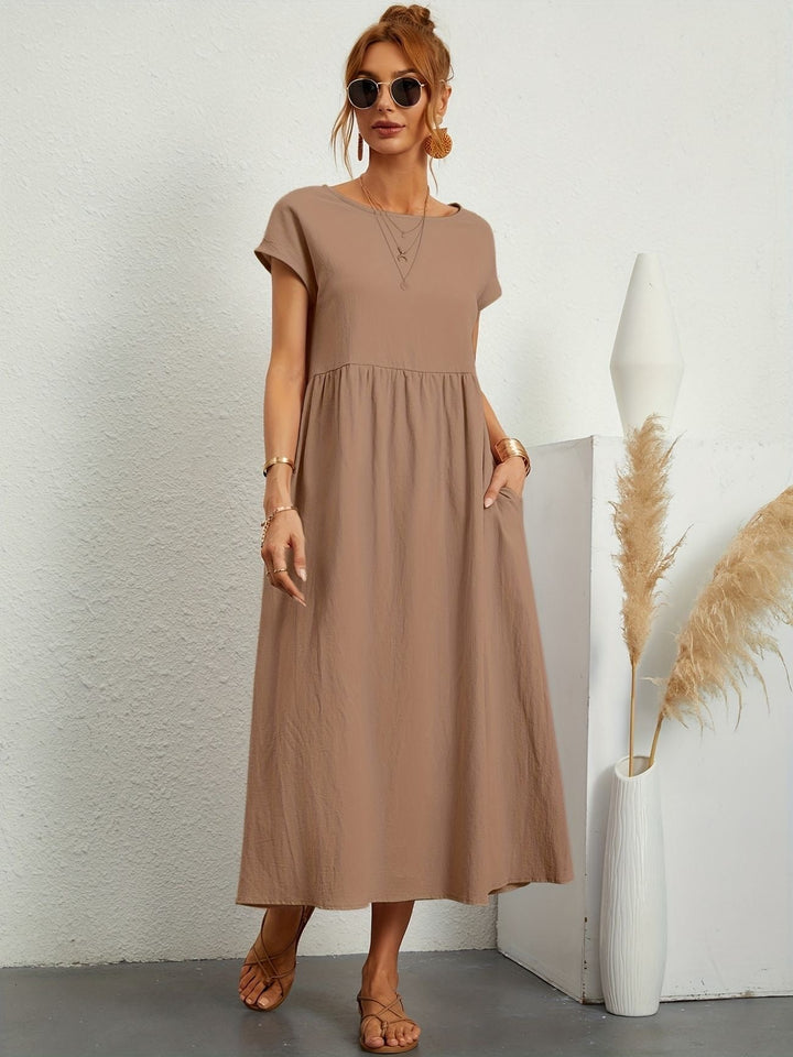 Vestido de lino fluido en un color vibrante para mujer. Ideal para un look fresco y veraniego.