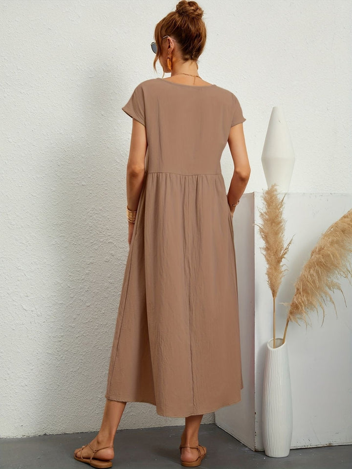 Estilo elegante y desenfadado con este vestido de lino fluido de mujer. Prenda esencial de verano.