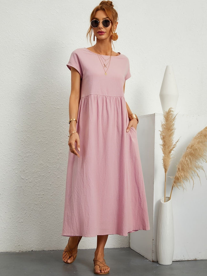 Vestido de lino de mujer con silueta fluida, perfecto para un atuendo casual o elegante de verano.