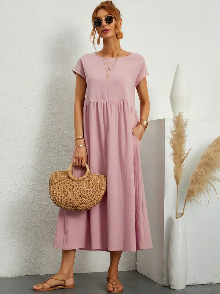 Vestido de verano midi fluido, estilo casual chic para mujer moderna.