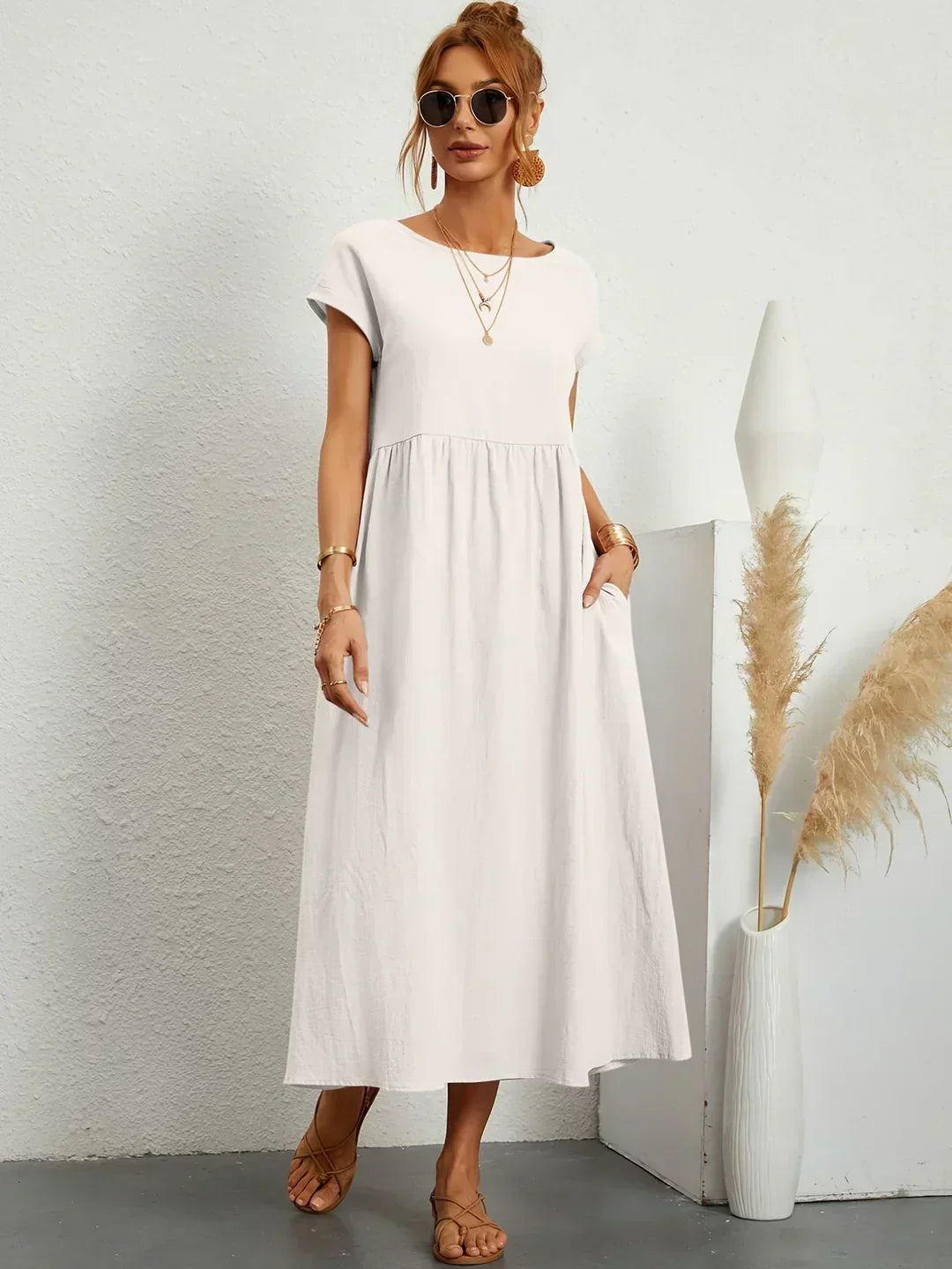 Vestido elegante midi fluido para mujer, silueta cómoda y sofisticada.