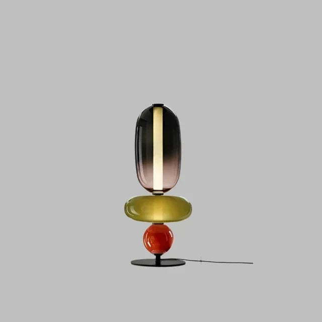 Lámpara de mesa LED escultórica negra y bronce, regulable, para iluminación contemporánea.