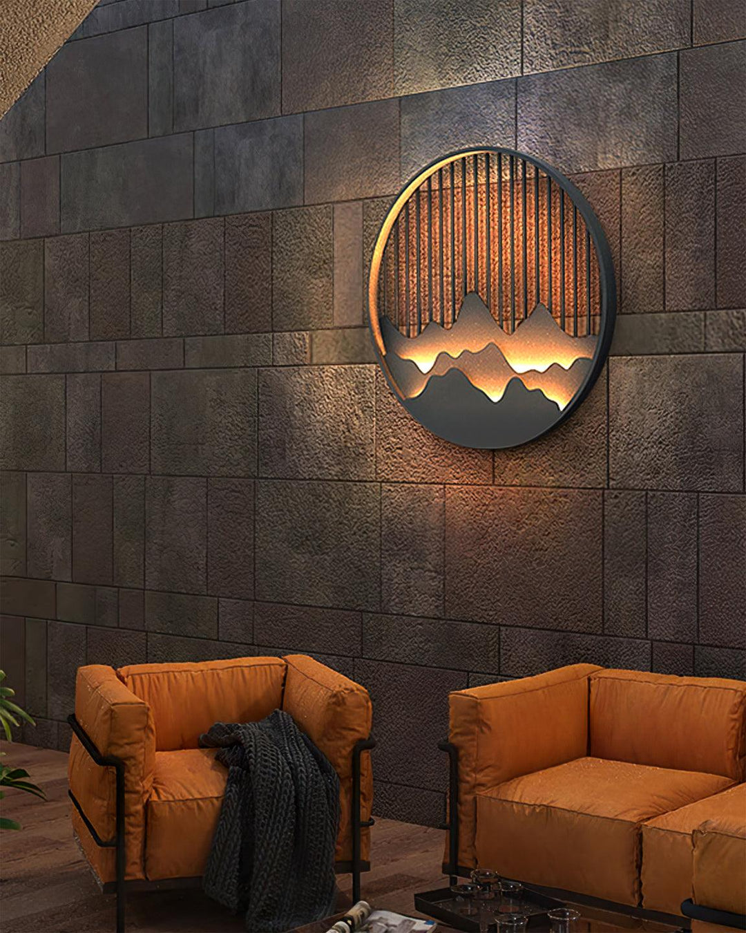 Iluminación decorativa LED para paredes, con forma circular y diseño de montañas moderno.