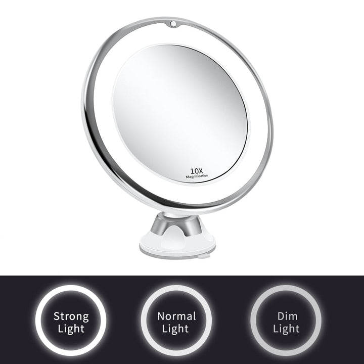 Espejo de maquillaje iluminado con luz LED y potente aumento 10X, portátil para belleza sin igual en casa o viaje.