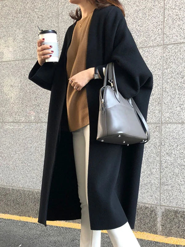 Abrigo largo de lana para mujer, un básico de moda clásica, perfecto para mantenerse abrigada con estilo.