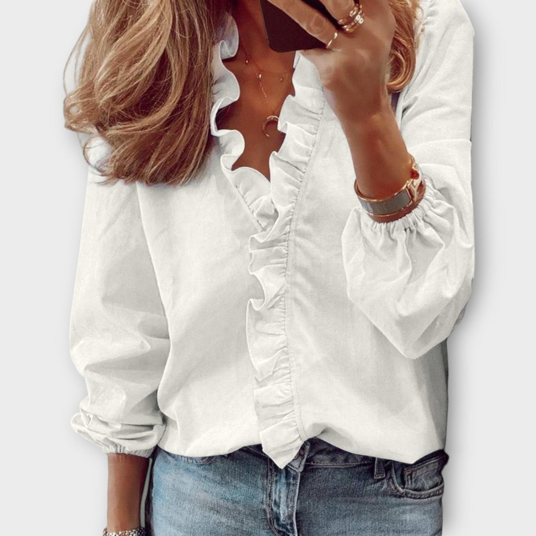 Blusa holgada de mujer con cuello V y manga larga, adornada con volantes, ideal para primavera.