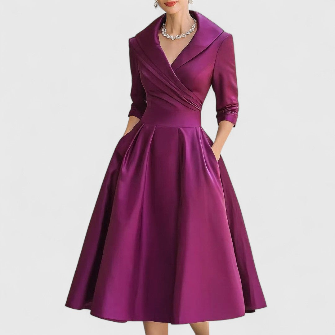 Vestido midi elegante para mujer con falda acampanada. Diseño atemporal y versátil para eventos elegantes.