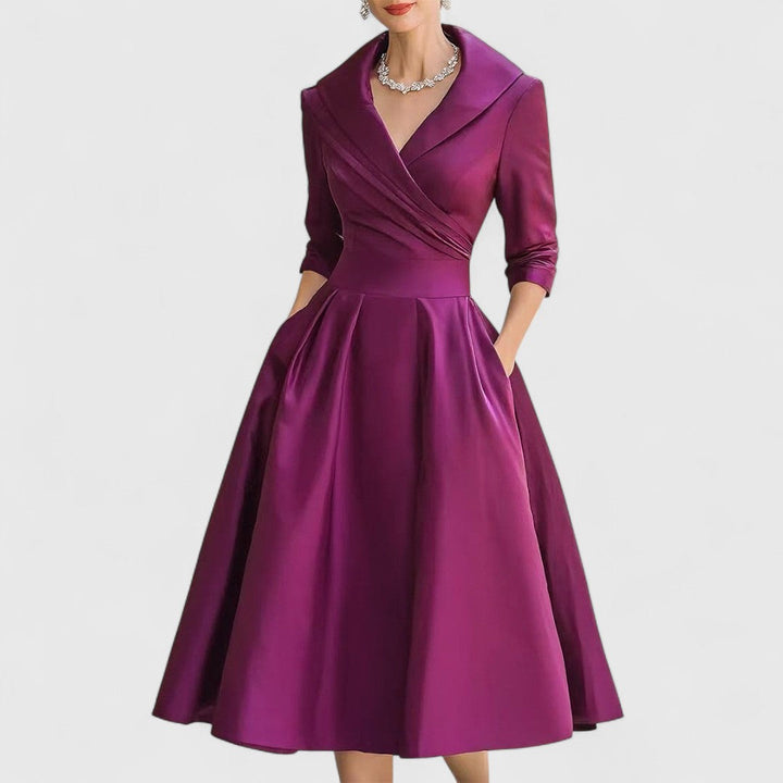 Vestido midi elegante para mujer con falda acampanada. Diseño atemporal y versátil para eventos elegantes.