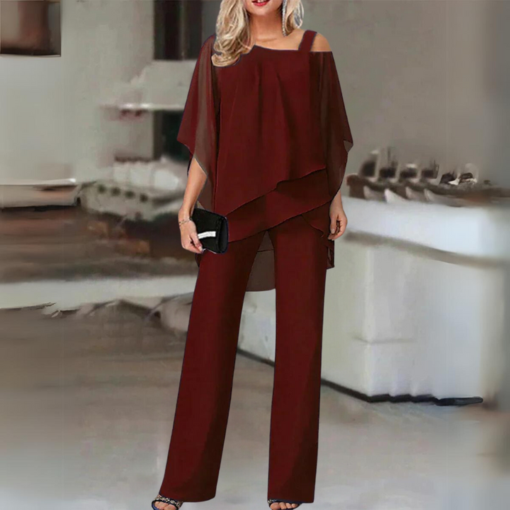 Conjunto femenino de dos piezas en poliéster y elastano, top manga larga y pantalón. Look elegante y moderno.
