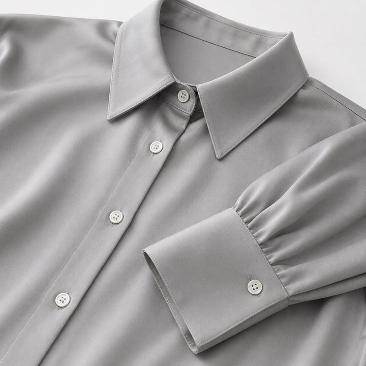 Blusa entallada de mujer, cuello solapa. Elegante y formal, con mangas largas. Perfecta para oficina.