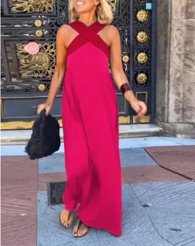Mujer caminando con vestido largo fluido de verano, hombros descubiertos. Ropa casual de mujer.