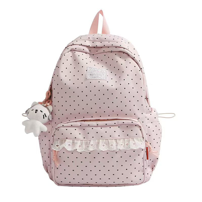 Mochila juvenil para mujer con lunares y volantes. Perfecta para la escuela, combina moda y funcionalidad.