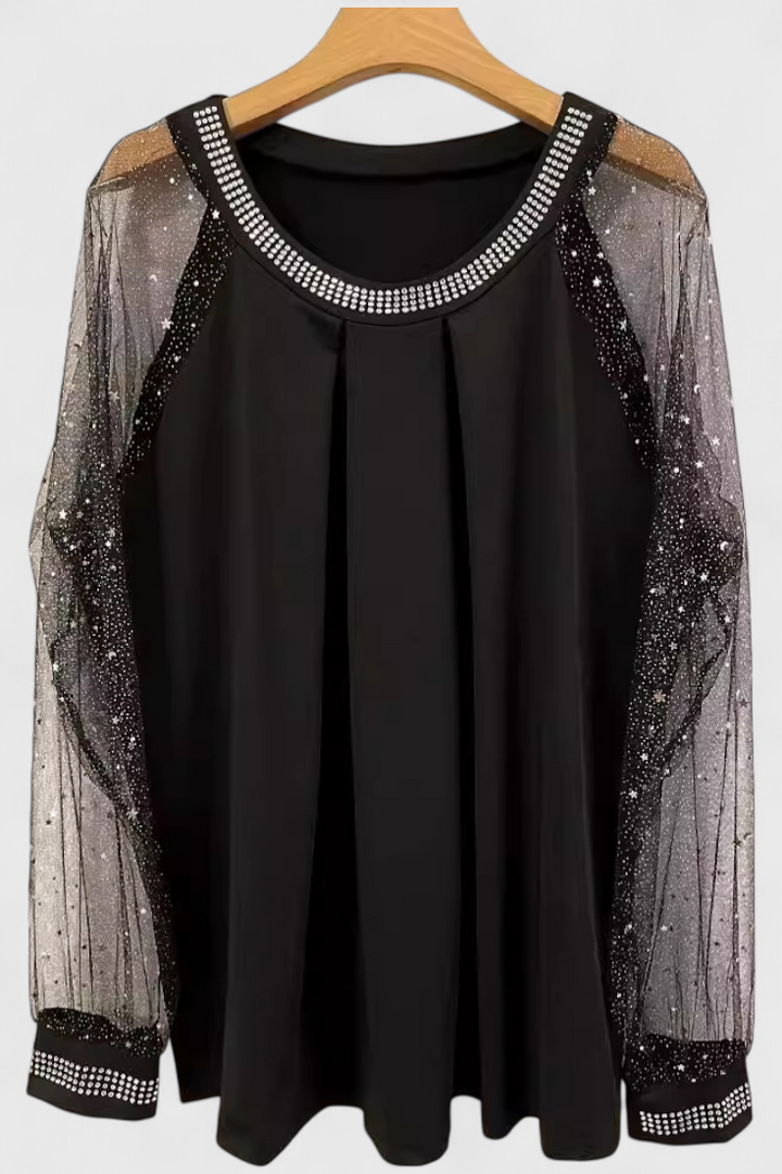 Top de mujer floral con strass y brillo deslumbrante en las mangas, perfecto para ropa de fiesta elegante.