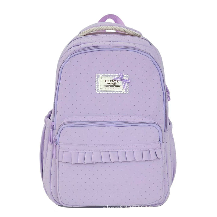 Mochila casual para mujer con volantes, patrón de lunares y diseño práctico para viaje.