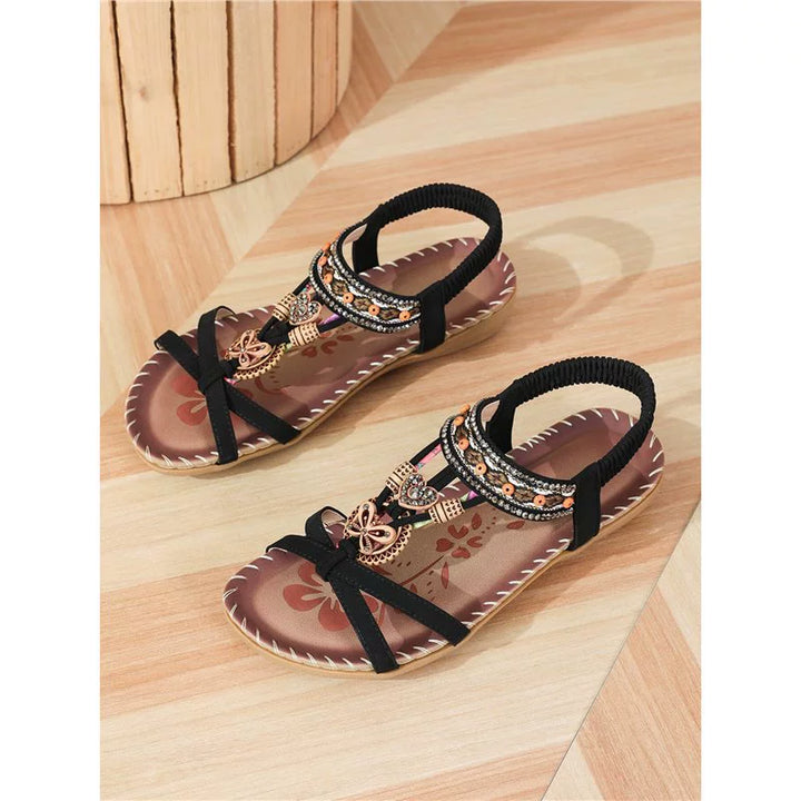 Calzado femenino bohemio para el verano, sandalias planas con diseño vibrante y confort duradero.