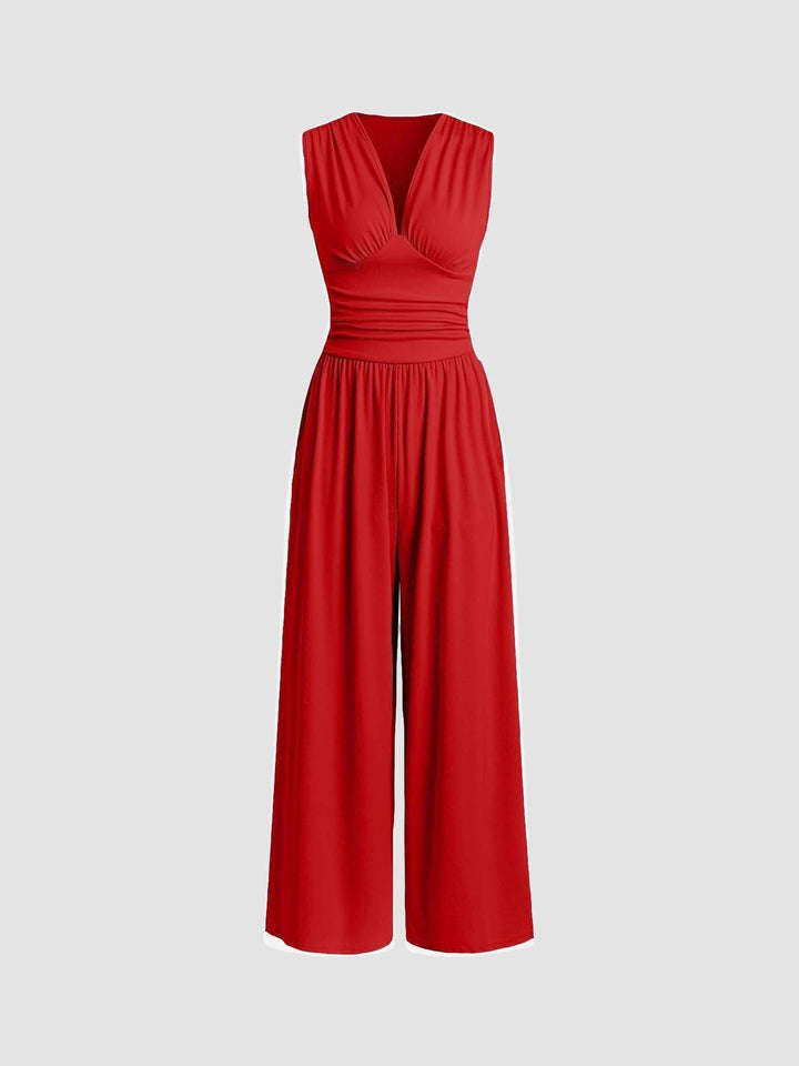 Jumpsuit fluido de mujer, escote en V. Mono de pierna ancha con tejido suave para un estilo sofisticado.