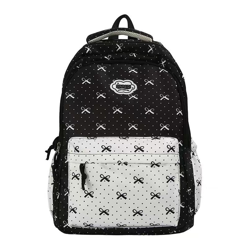 Mochila escolar duradera para niñas con lazos, diseño elegante y comodidad garantizada para el día a día.