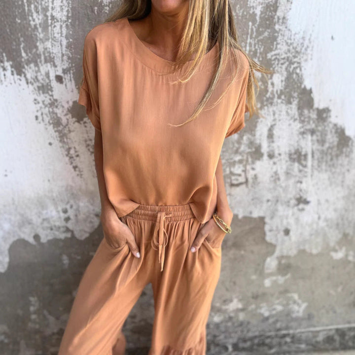 Outfit de lino para mujer: blusa y pantalón relajado. Estilo casual chic para verano, moda femenina cómoda y fresca.