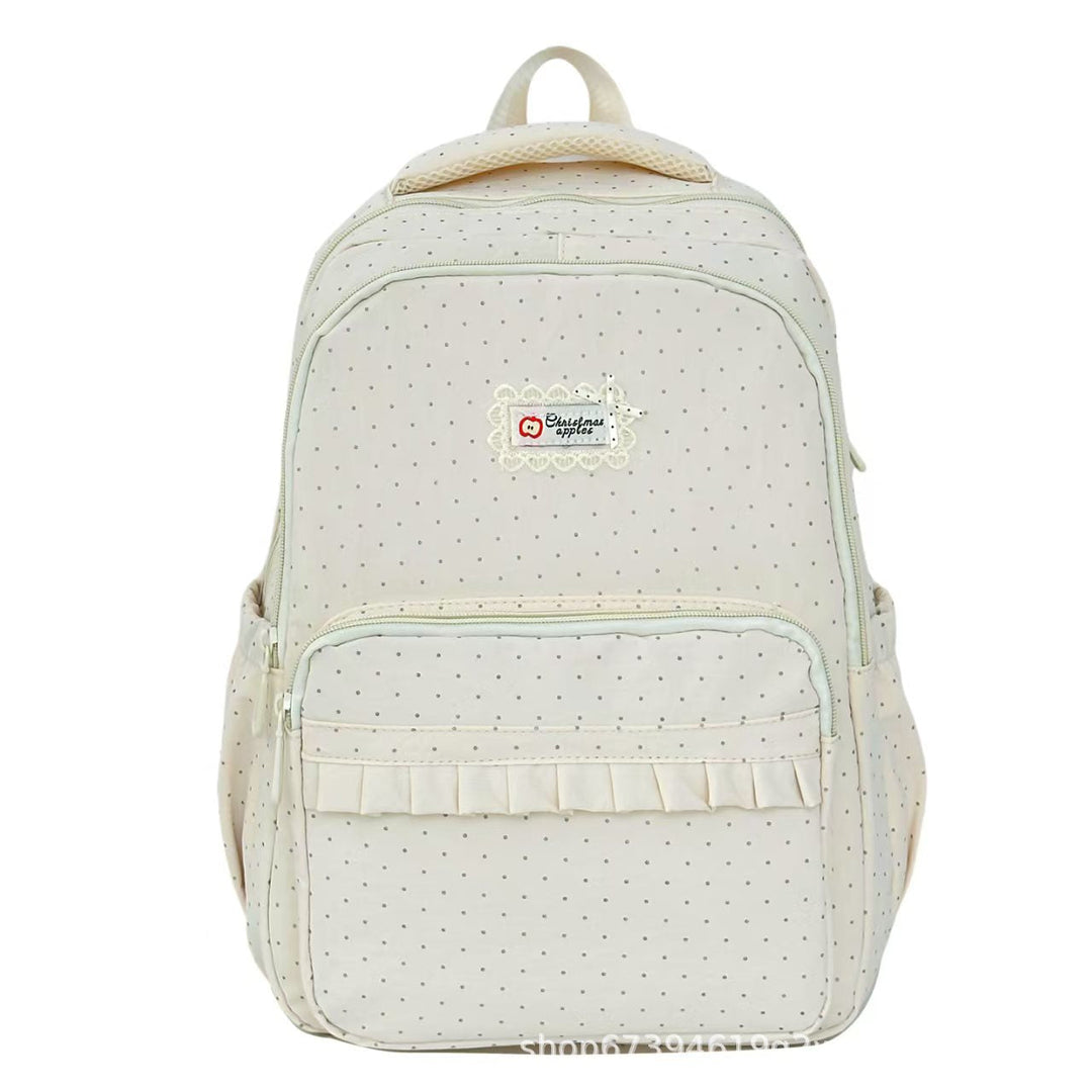 Mochila de mujer elegante con volantes y estampado de lunares, perfecta para moda casual diaria.