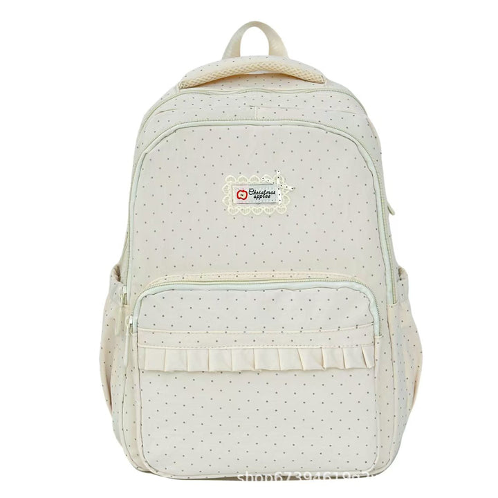 Mochila de mujer elegante con volantes y estampado de lunares, perfecta para moda casual diaria.
