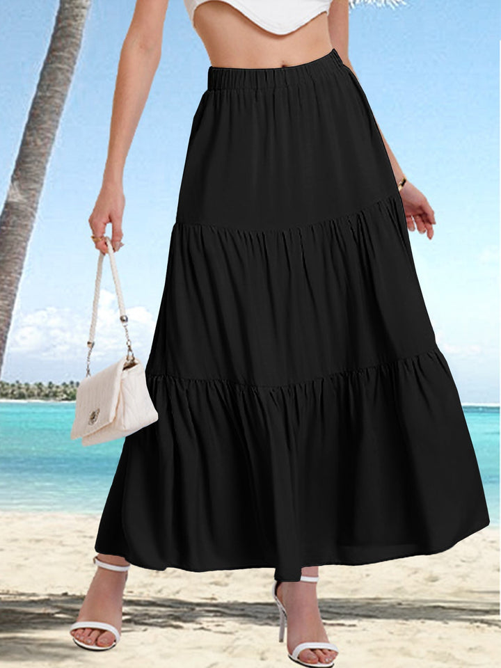 Textura ligera de falda midi BASILISA con volantes, una prenda cómoda y elegante para el verano.