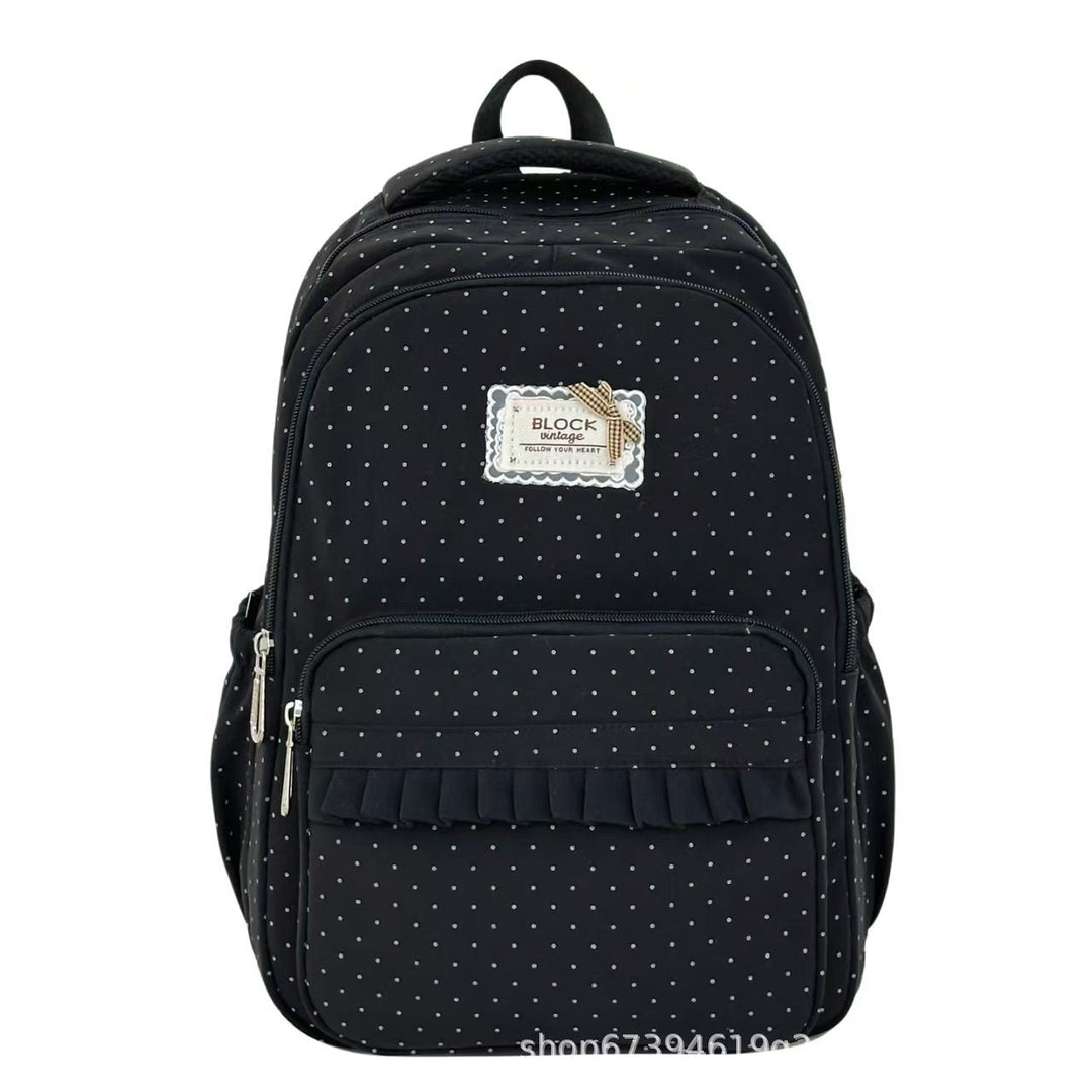 Mochila de mujer con volantes y lunares, ideal como accesorio de moda para cualquier ocasión.