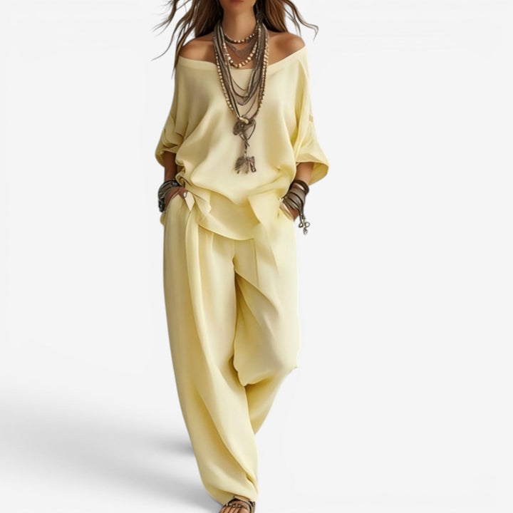 Top de hombros al aire y pantalón amplio fluido de conjunto bohemio para mujer. Ropa de verano casual y elegante.