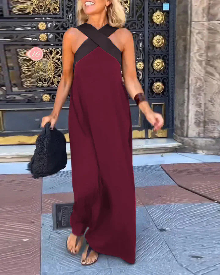 Mujer luciendo un vestido largo fluido de verano con hombros descubiertos, estilo casual y elegante.