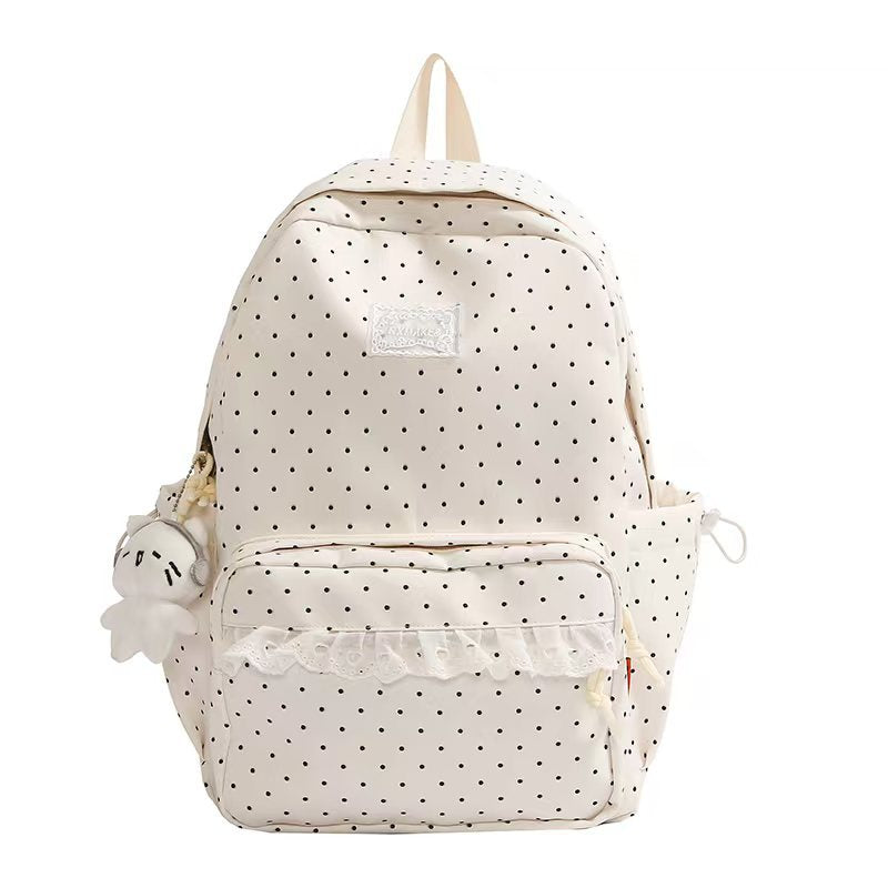 Mochila escolar de mujer con volantes y diseño de lunares. Ideal para un estilo juvenil y moderno.