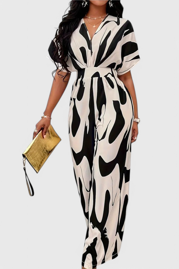 Mono Zahara de mujer con estampado abstracto, estilo elegante y versátil, ideal para fiesta o verano. Moda.