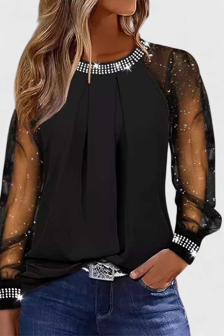 Blusa floral de mujer con mangas sofisticadas, brillo sutil y diseño elegante. Ideal para ocasiones especiales.