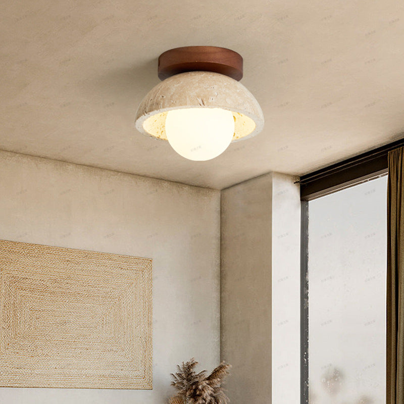 Lámpara de pared LED estilo boho-chic, fabricada con travertino natural para una decoración única.