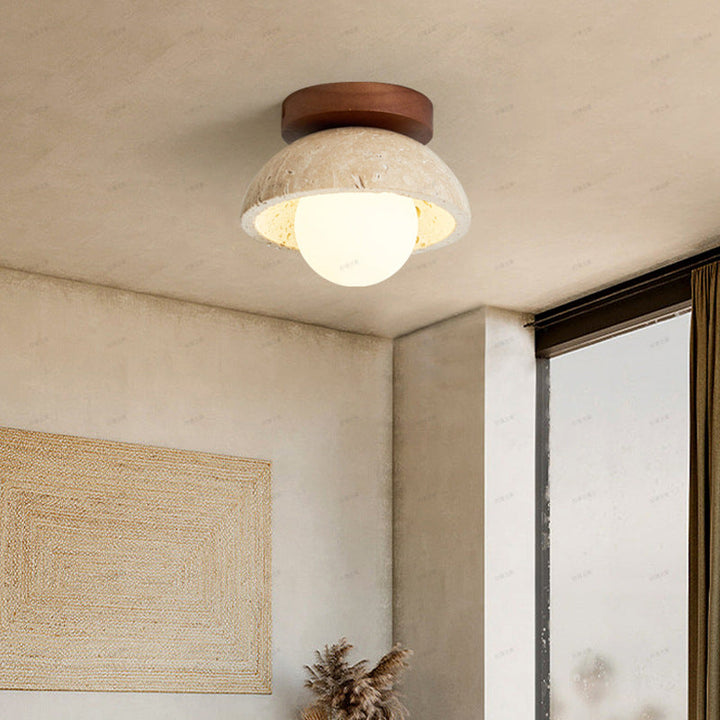 Lámpara de pared LED estilo boho-chic, fabricada con travertino natural para una decoración única.