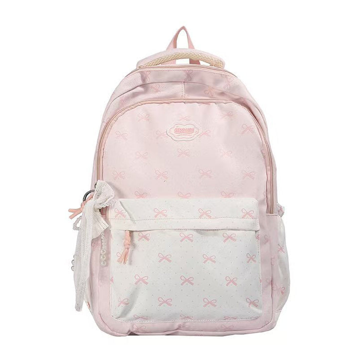 Mochila escolar rosa para niñas con detalles de lazos, ofrece comodidad y estilo duradero para la escuela.
