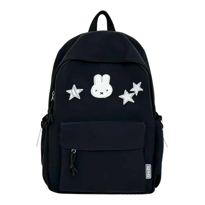 Mochila bordada de conejo y estrellas, un accesorio juvenil para escuela o universidad.
