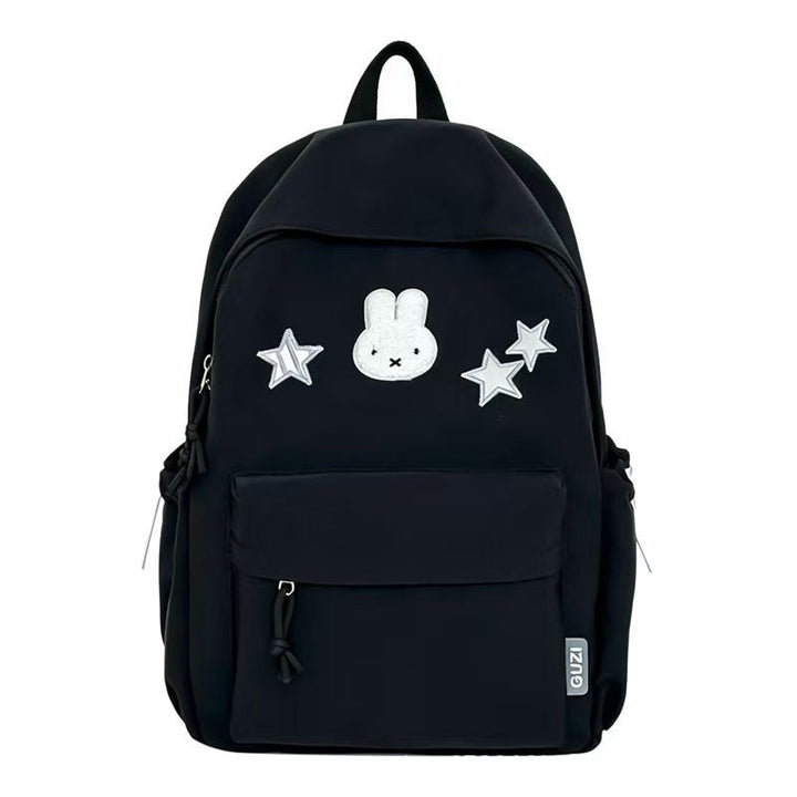 Mochila bordada de conejo y estrellas, un accesorio juvenil para escuela o universidad.