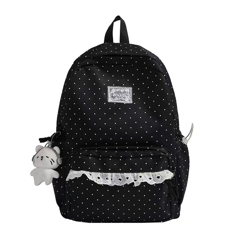 Mochila escolar con volantes y diseño de lunares para mujer, accesorio de estilo único y cómodo.