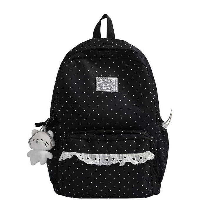 Mochila escolar con volantes y diseño de lunares para mujer, accesorio de estilo único y cómodo.