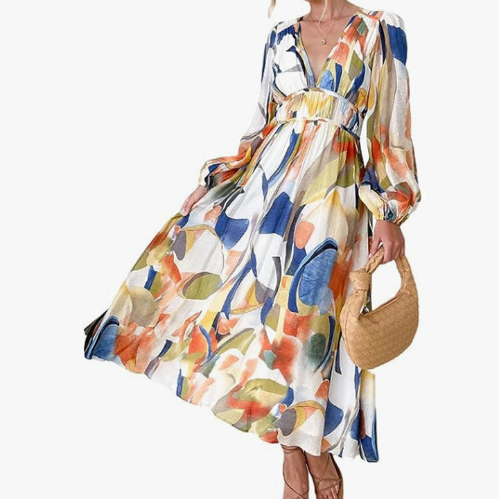 Vestido midi de moda para mujer. Estampado floral, escote cruzado y falda con vuelo.