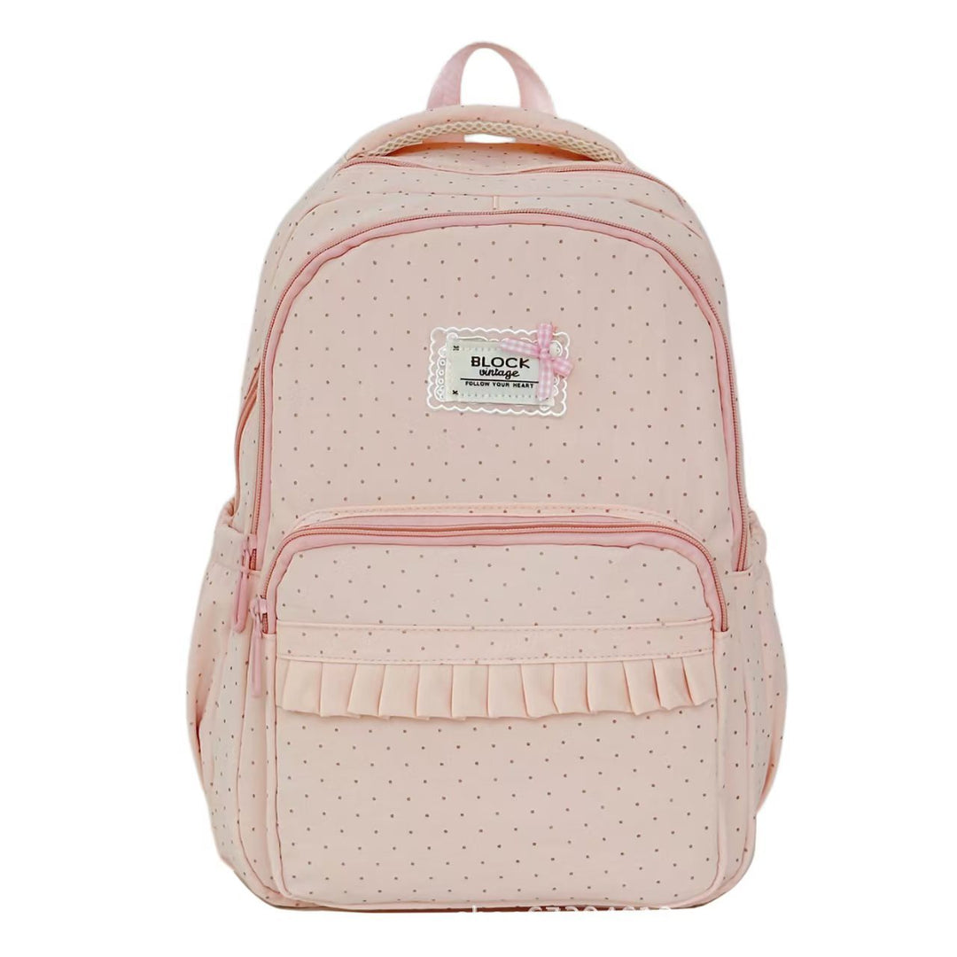 Mochila de moda para mujer, diseño chic con volantes y lunares, accesorio elegante y funcional.