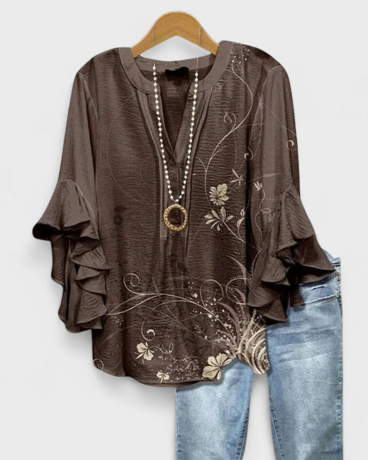 Blusa ligera para mujer con estampado floral primaveral, ideal para un look casual y cómodo.