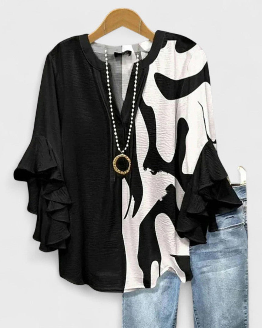 Blusa de mujer fresca con volantes y diseño floral, perfecta para el verano diario y casual.