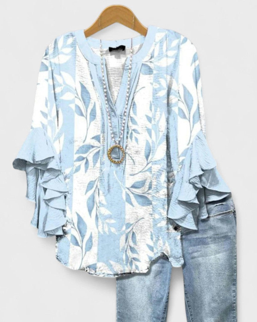 Elegante blusa floral de manga corta para mujer, cómoda y fresca para días cálidos de verano.