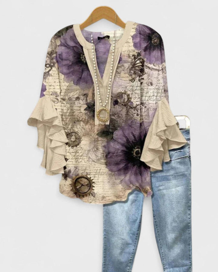 Blusa elegante de mujer, manga corta y estampado floral, ideal para primavera y verano.