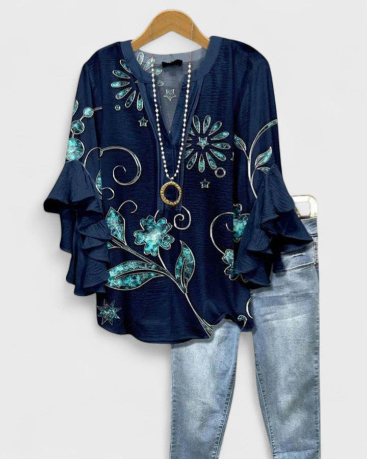 Blusa de mujer con estampado floral, manga corta y volantes, ideal para el verano casual.