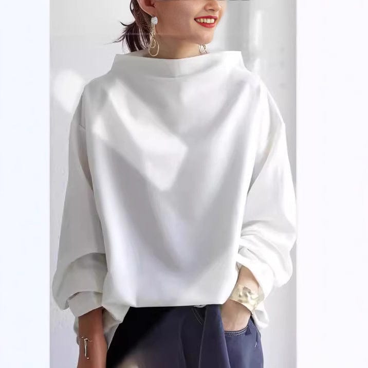 Moda mujer: blusa casual con cuello caja y manga larga. Prenda básica de estilo relajado, perfecta para otoño.