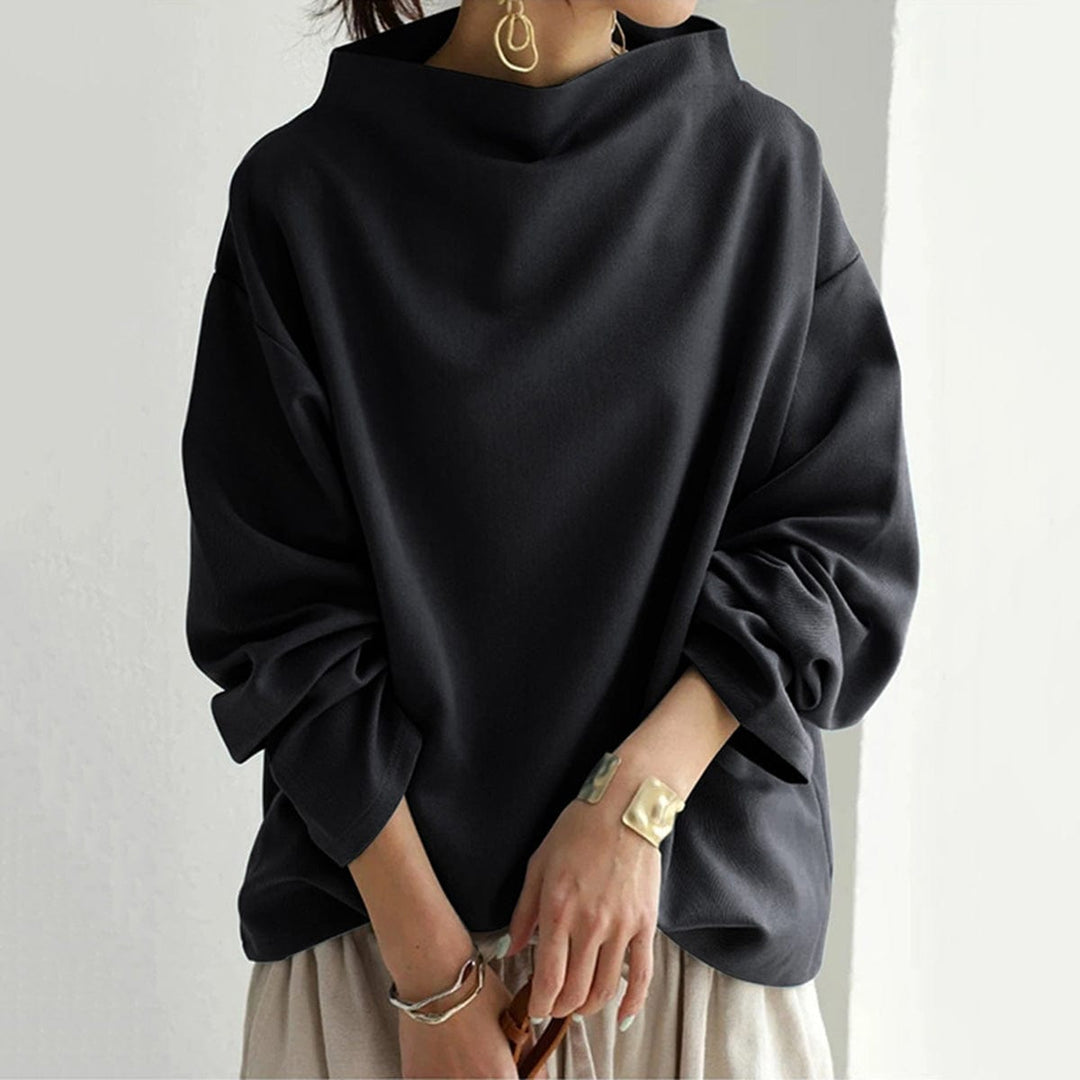 Blusa de día, manga larga y cuello caja para mujer. Diseño holgado y cómodo, ideal para un outfit casual versátil.